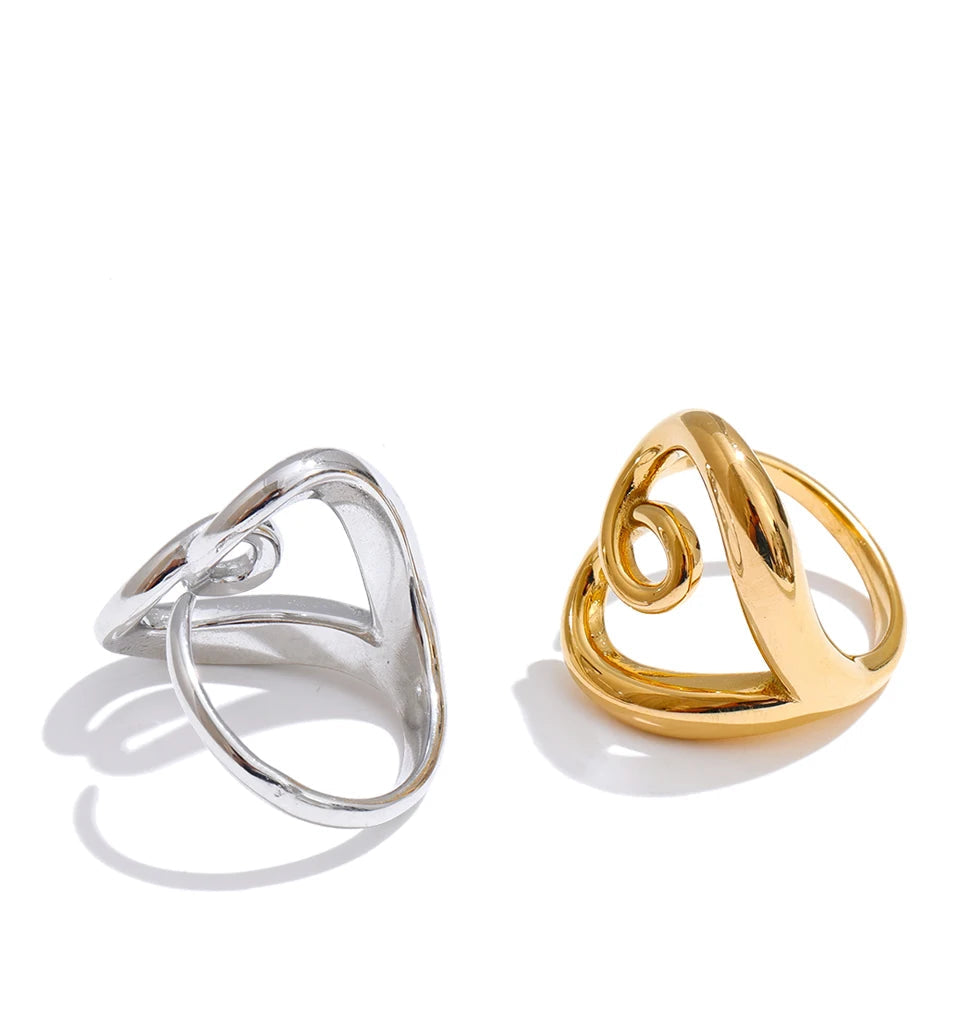 Adjustable heart shaped ring with sleek platinum tone