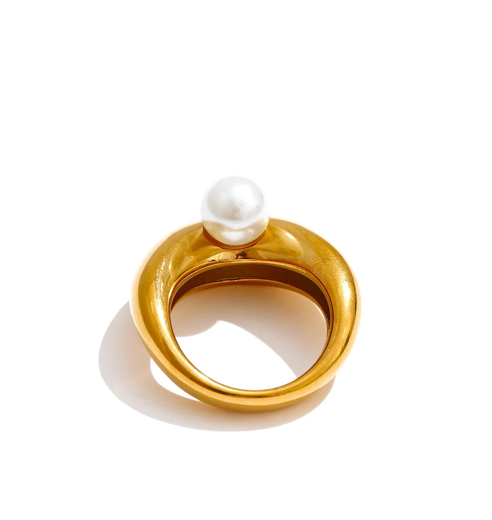 A pearl ring with smooth gold plated band