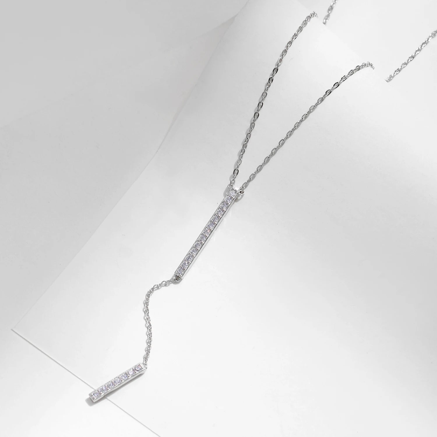 Lariat jewelry in 925 silver shown with a graceful long chain drape