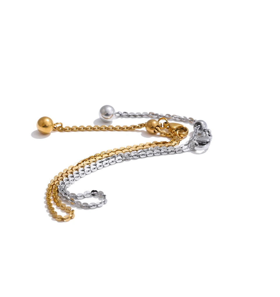 Flat lay of bracelet bracelets with stretch chain bracelet center