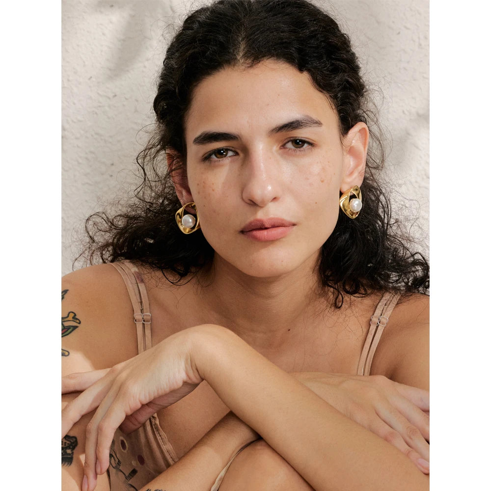 Close view of stud earring showing earring pearl detail with polished finish