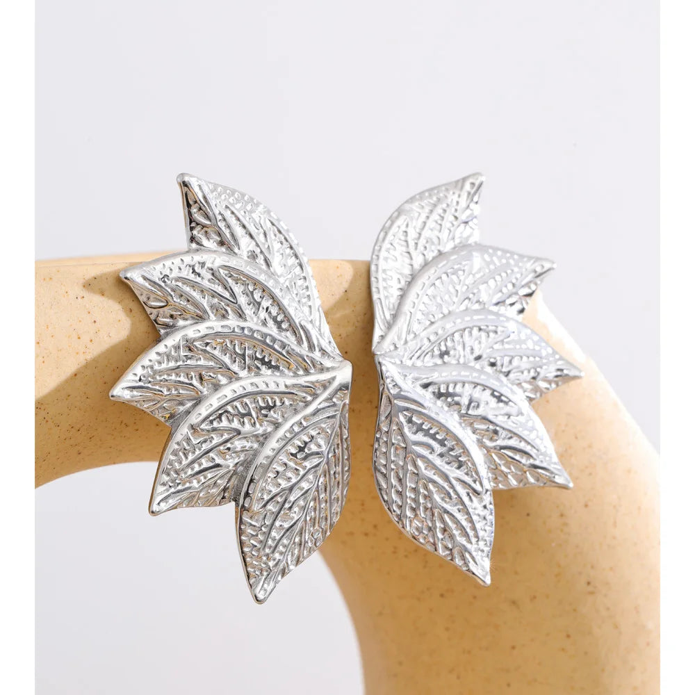 Women wearing elegant leaf stud earrings gold plated jewelry