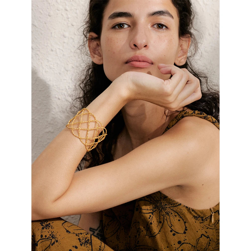 Close-up of gold bracelet bracelet with polished stainless steel finish