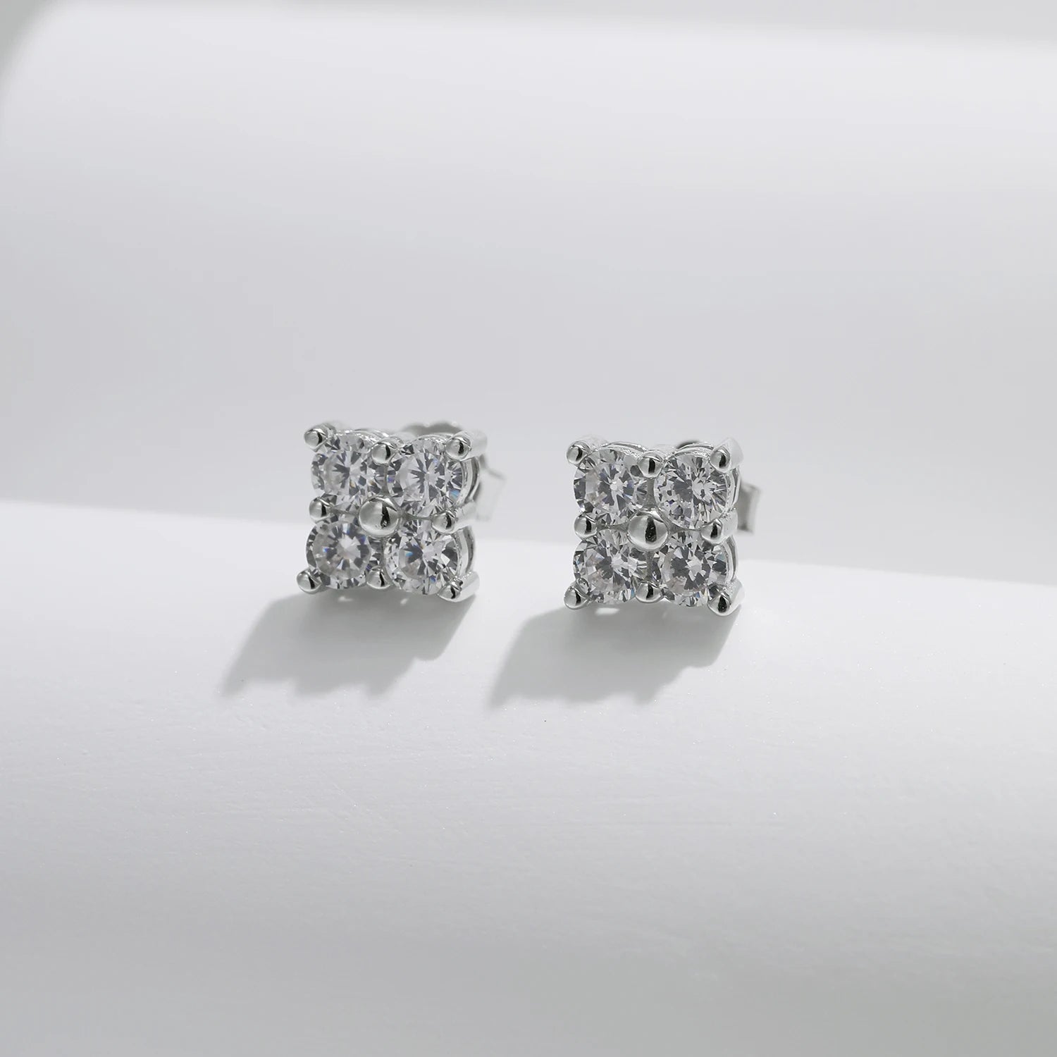 Minimalist stud earrings that highlight moissanite jewelry glow in silver color
