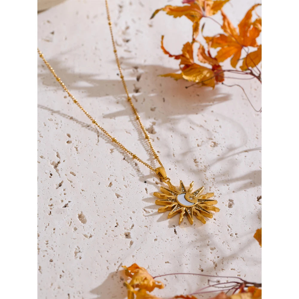 Close view of pendant necklace showing moon necklace charm with polished edges