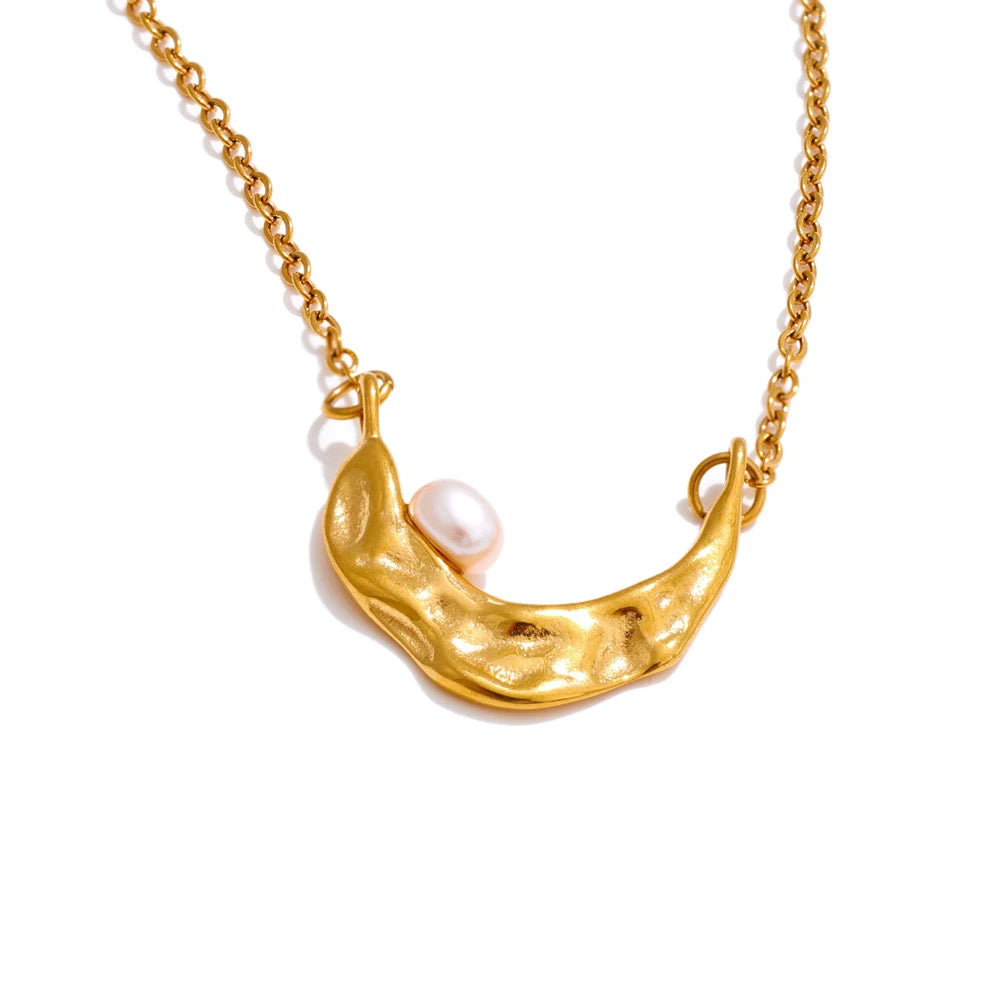 Charm necklace showing a pearl on necklace shine for golden jewelry looks