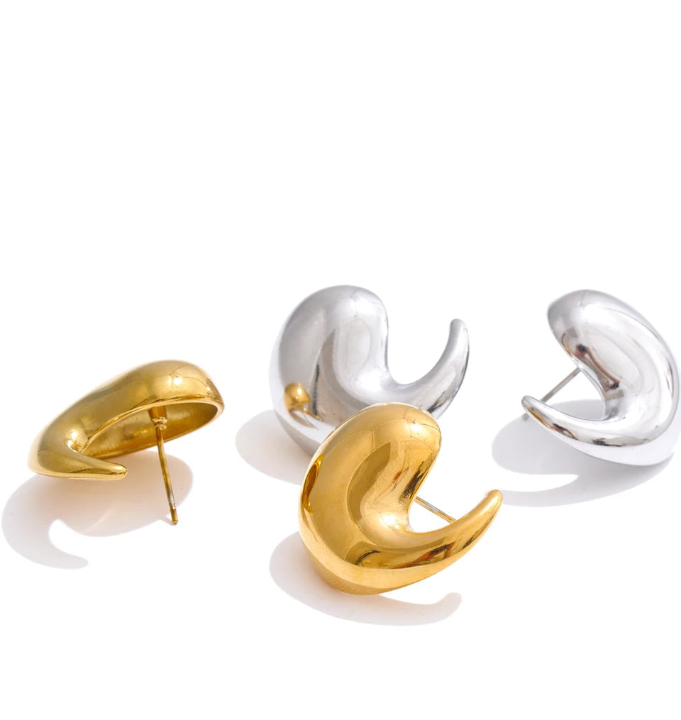 Side view of comma stud showing smooth texture and gold plated surface