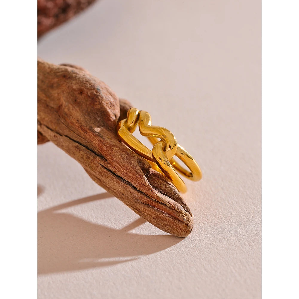 Refined gold and ring look with subtle heart ring detail