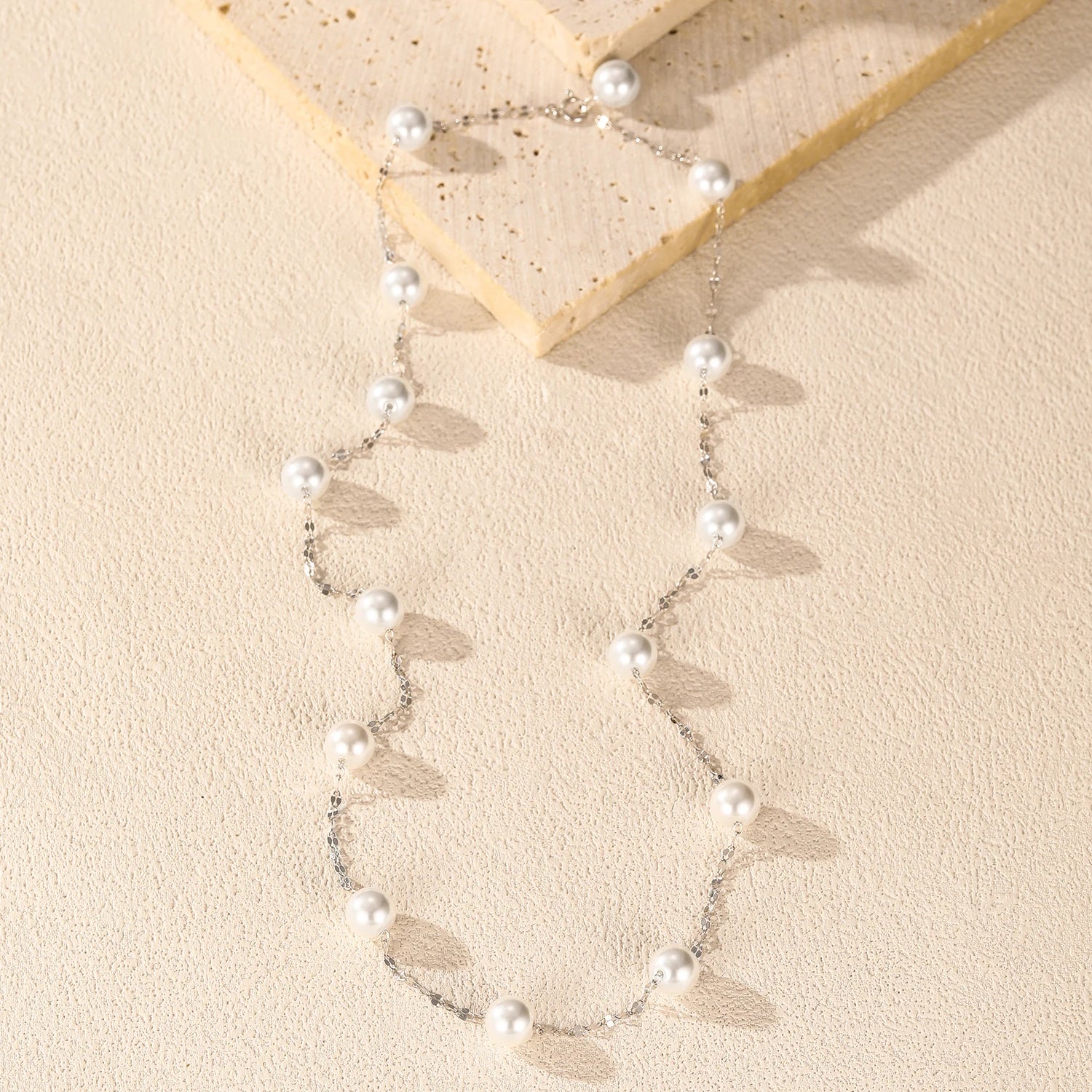 Sterling silver necklace with a Y-shape drop of pearls and crystals