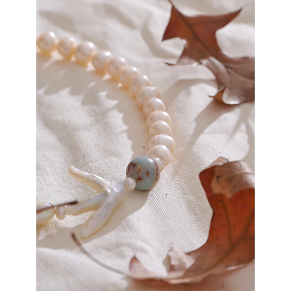 Pearl on necklace crafted with stainless steel gold plated chain