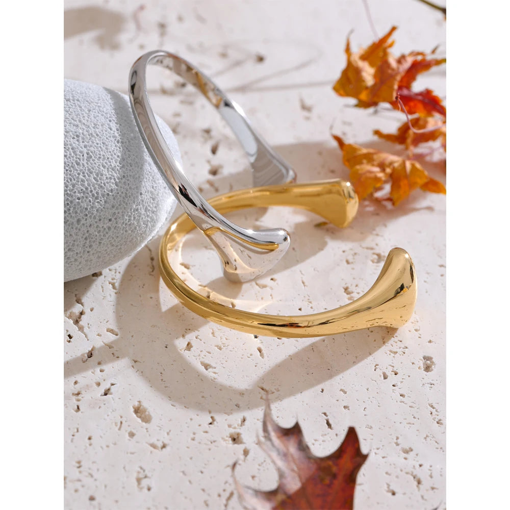 Close-up of gold bracelet bangle in stainless steel design