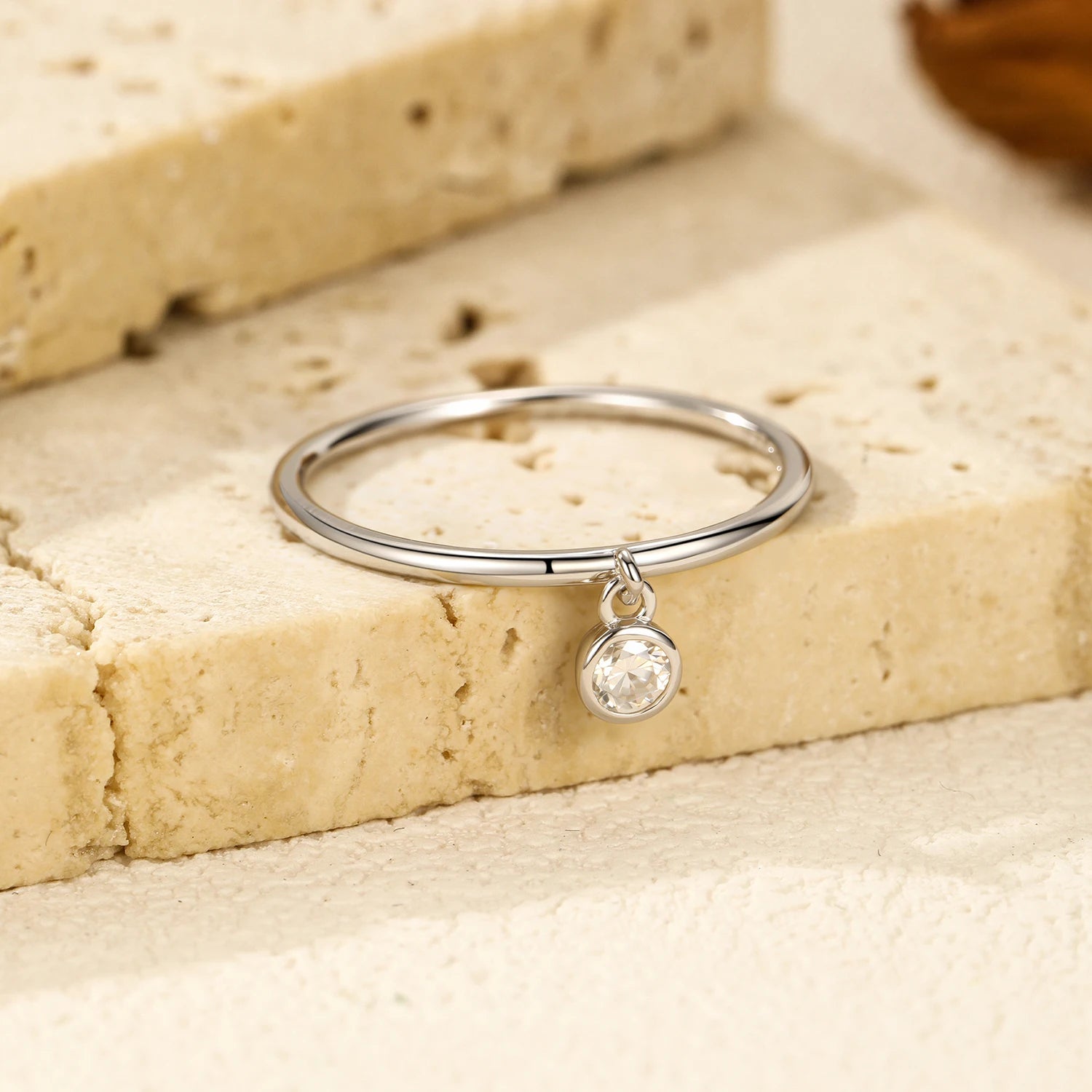 Polished 925 sterling silver band featuring moissanite diamonds center