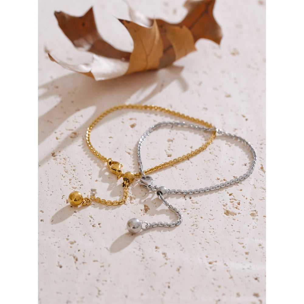 Close up of chain bracelet bangle showing polished surface and flexible fit