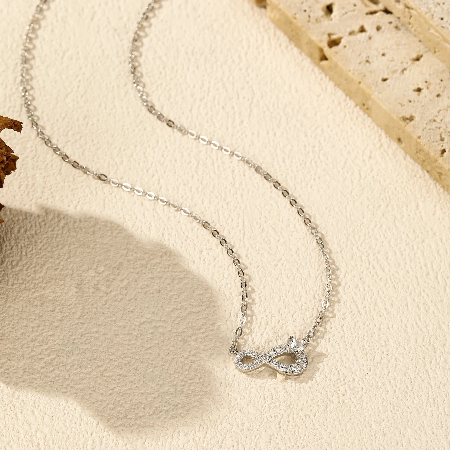 Layered necklace and necklace look using a sterling silver necklace