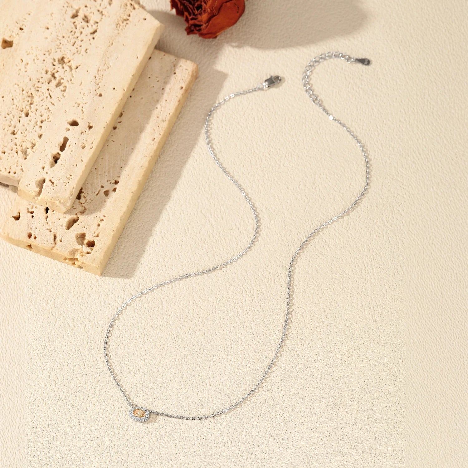 Women necklace combining vibrant moissanite jewelry with classic silver chain