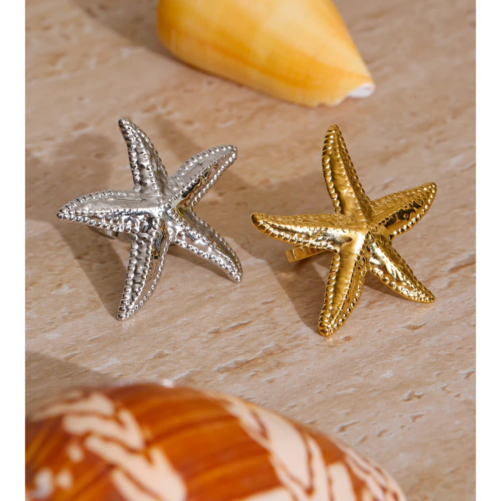 Ring in a finger featuring textured starfish design