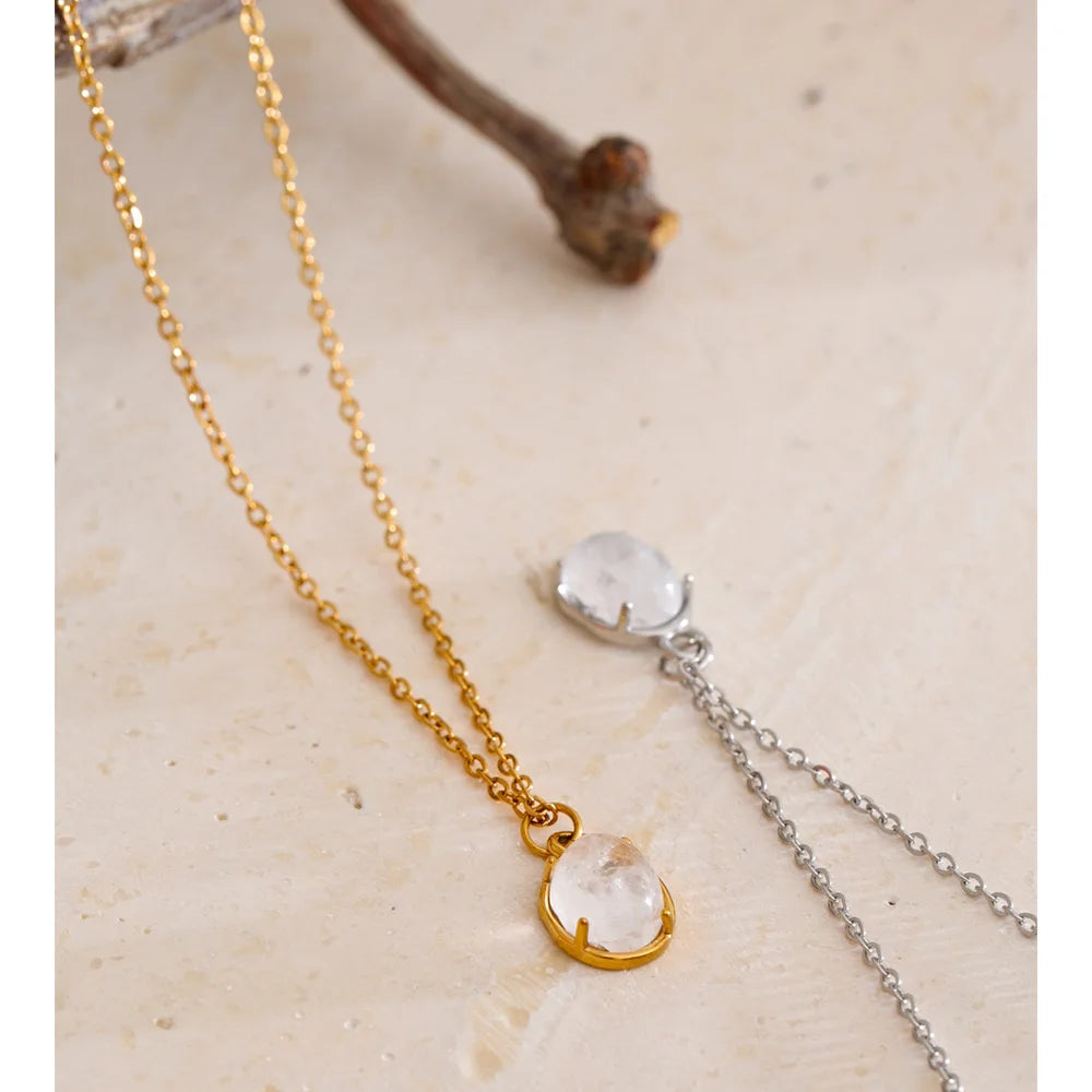 Close up of necklace and necklace layering with stone pendant