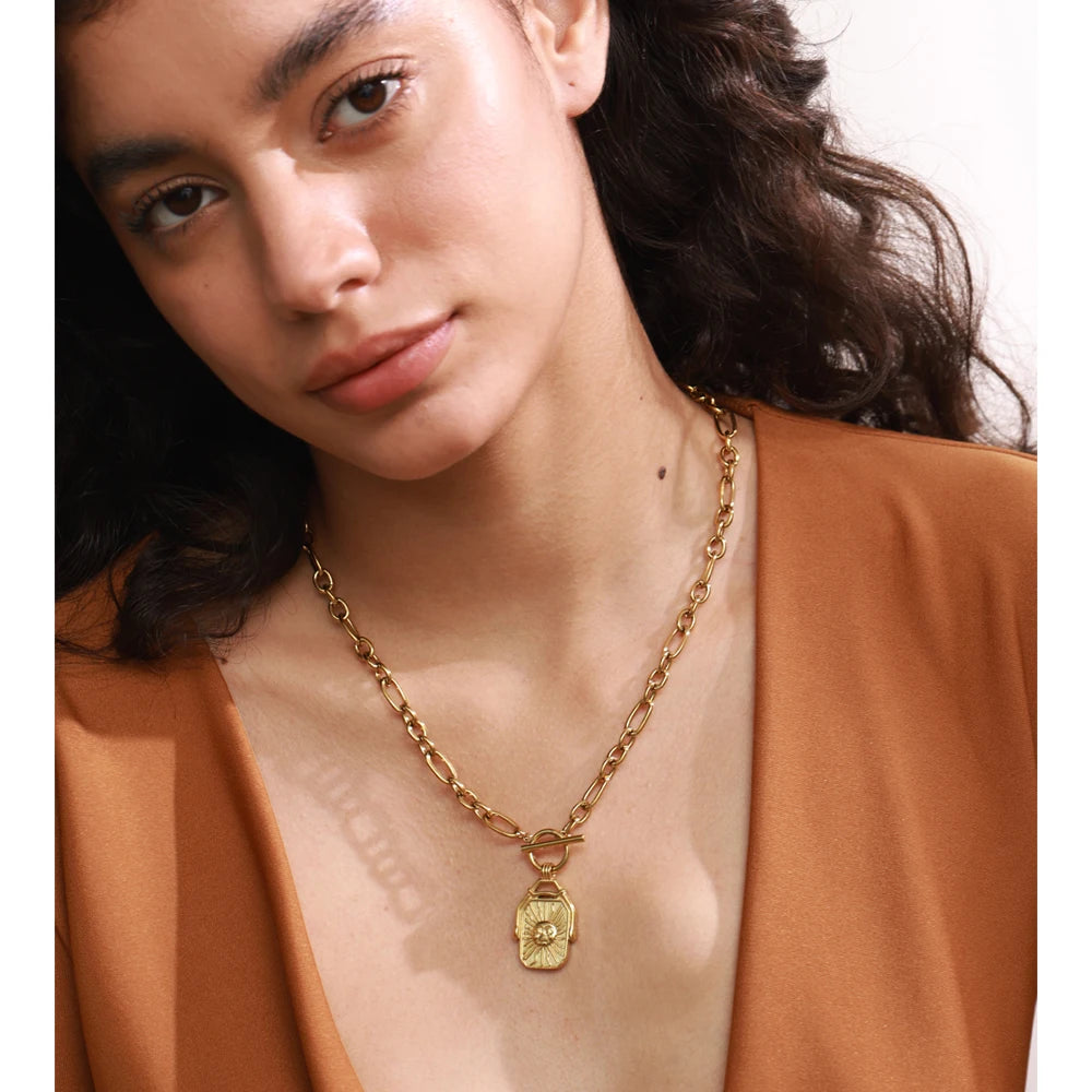 elegant gold pendant necklace rectangle sun moon motif on gold plated chain