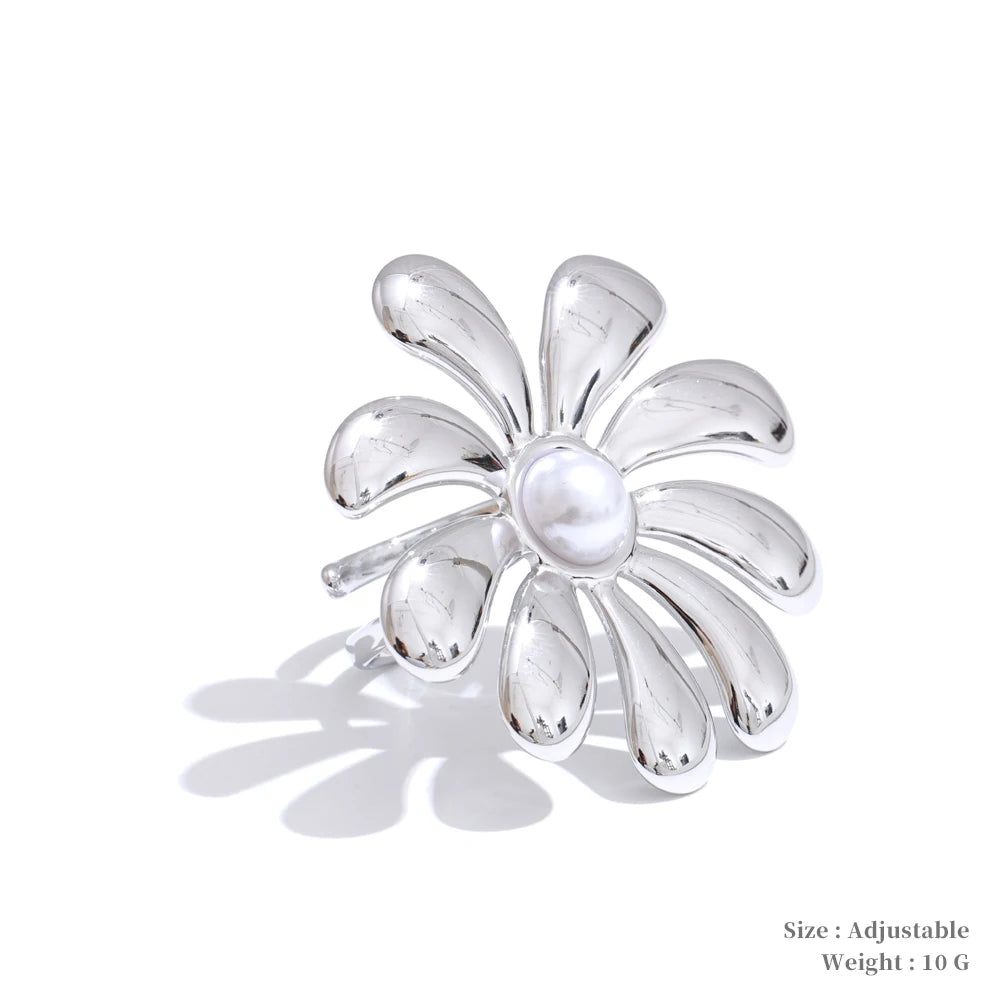 Stainless steel jewelry base supporting a gold chain with necklace pearls