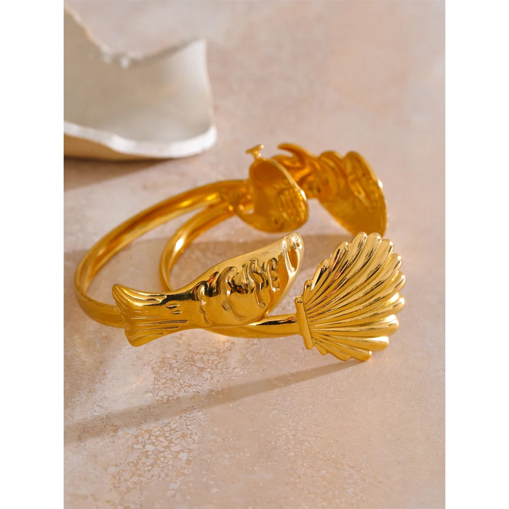 Wrist image pairing bangle and bracelet layers with a sleek cuff