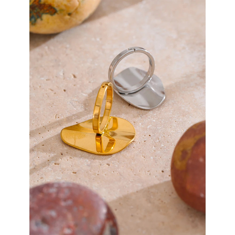 Sleek silver color band paired with rings gold rings looks