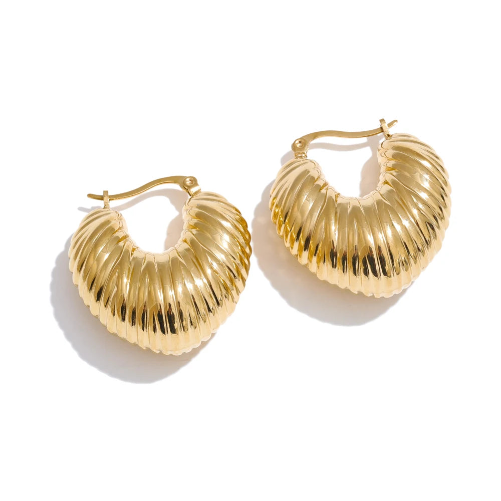 Editorial shot styling earrings earrings gold with modern outfits