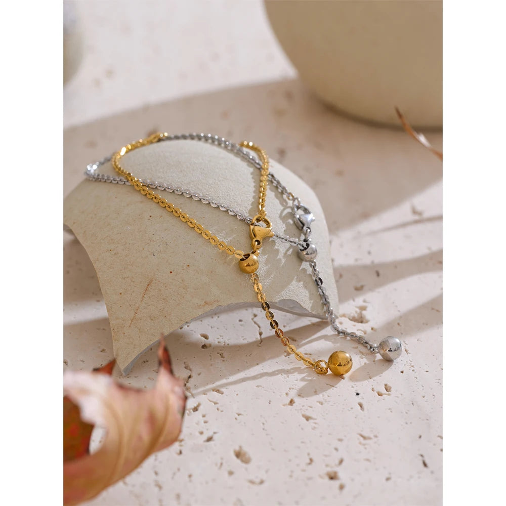 Stack of bracelet bracelets featuring a stretch chain bracelet bangle