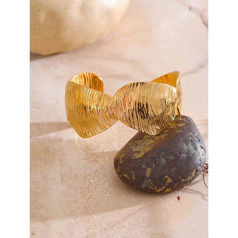 Minimal gold cuff highlighting bracelet charm styling for bracelet and charm looks