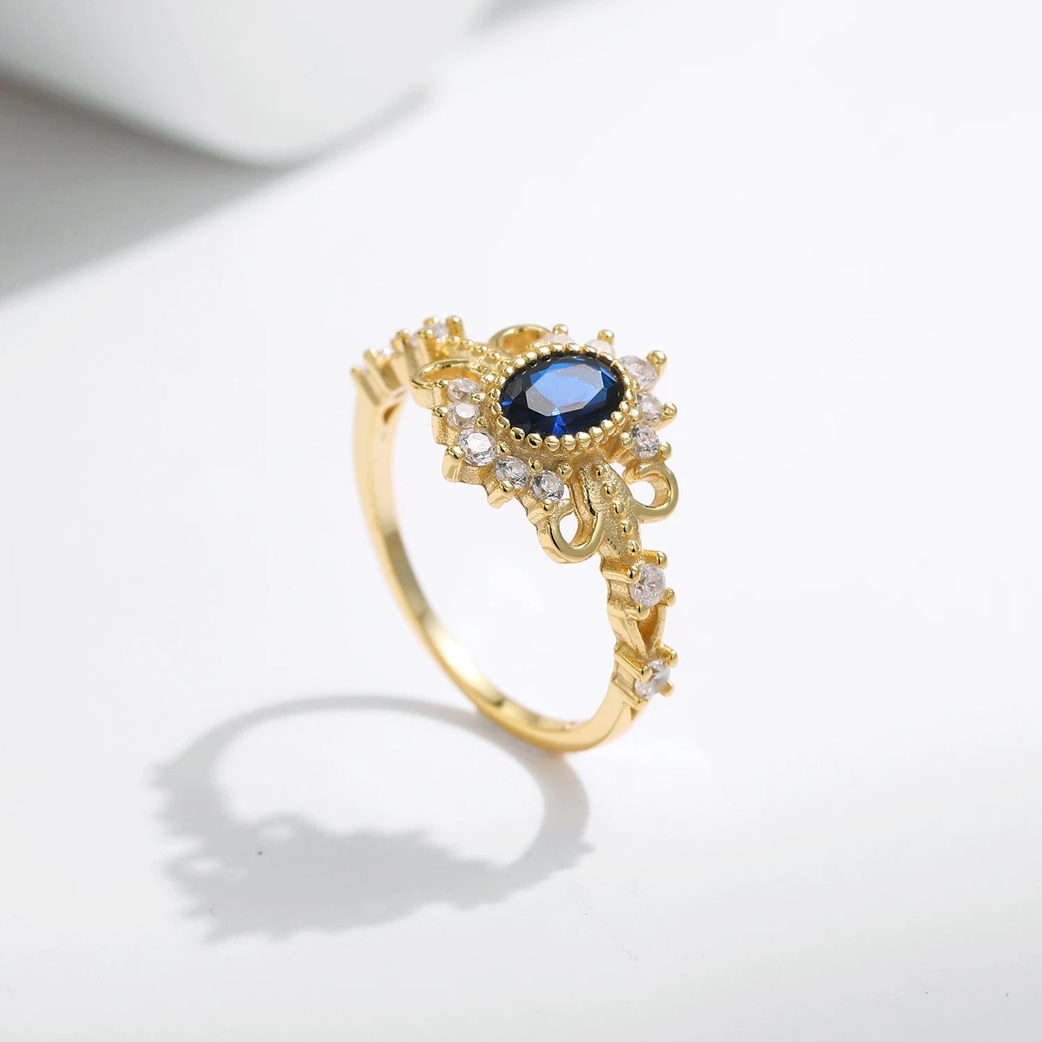 Regal crown jewelry ring in silver with blue zirconia accent