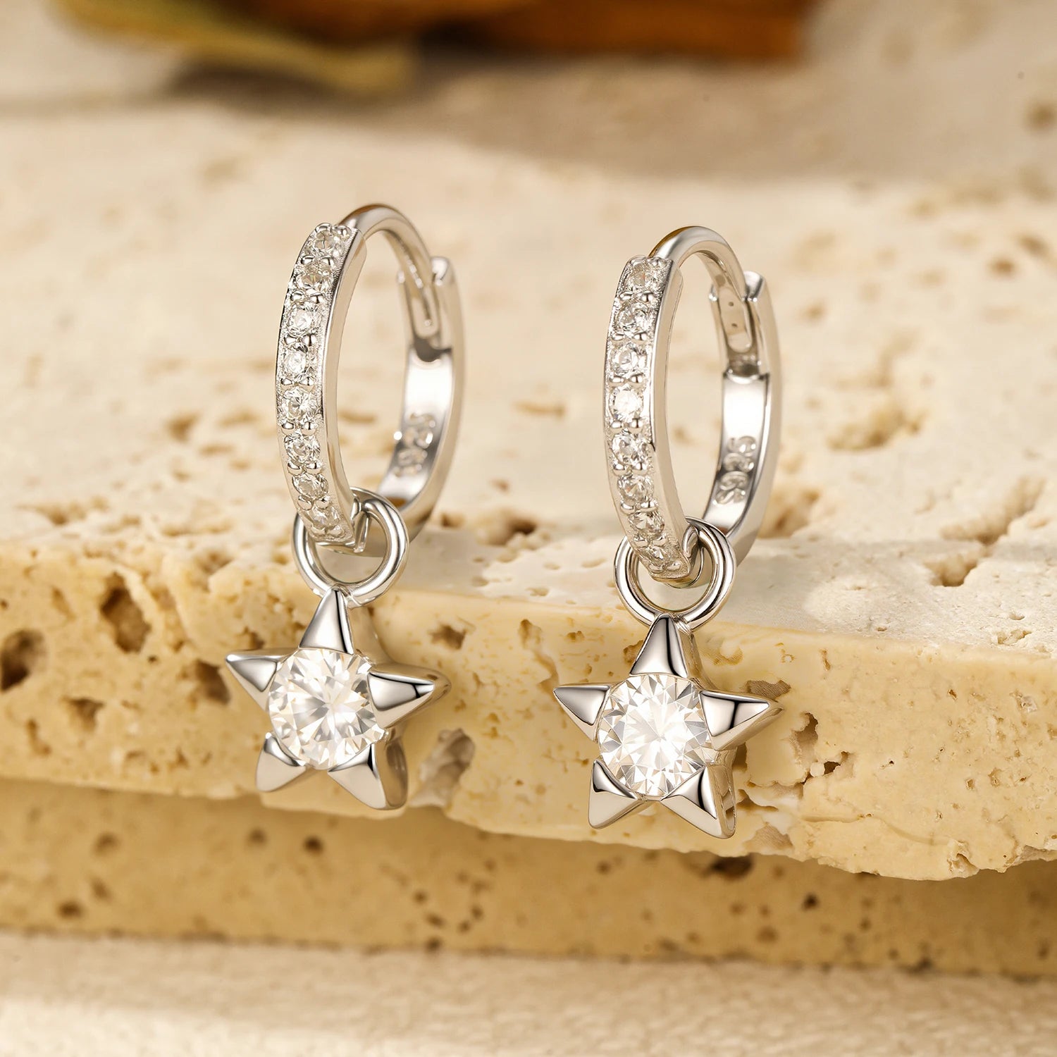Polished sterling silver star hoops with bright moissanite earrings accents