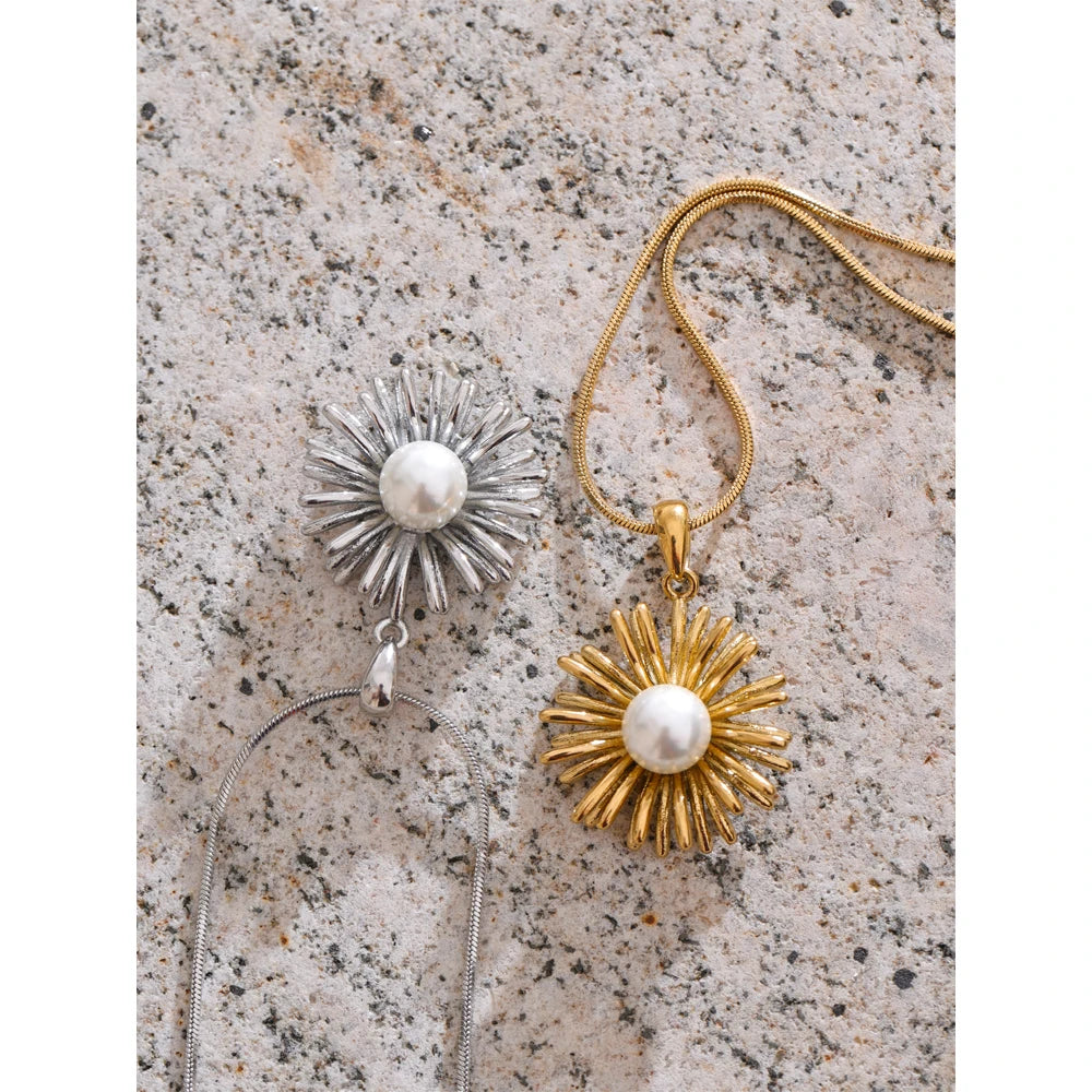 Close-up of necklace pearl detail on a floral pendant with gold plated finish