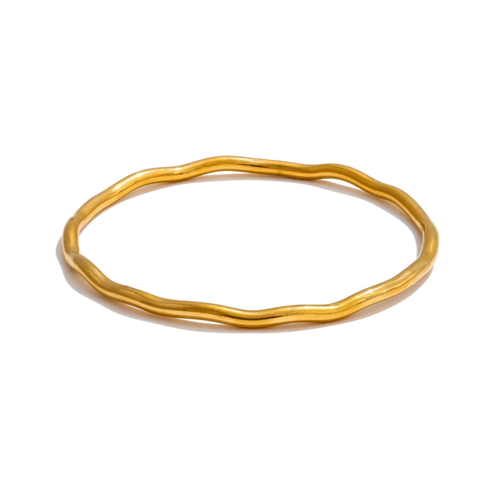 Hammered gold plated bangle bracelet showing polished edges for women jewelry