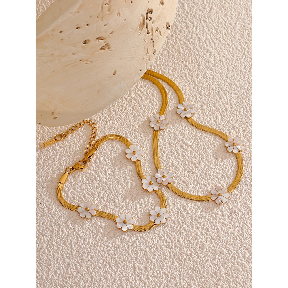 Graceful gold i necklace styled with a bracelet for gold elegance