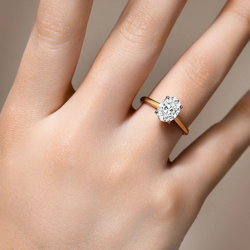 Rings with moissanite paired around an oval ring moissanite centerpiece