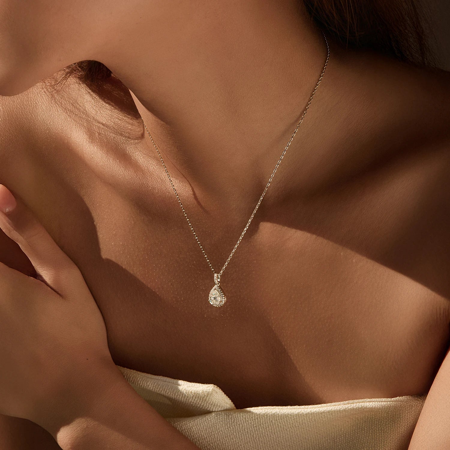 Elegant sterling silver necklace with droplet moissanite diamond