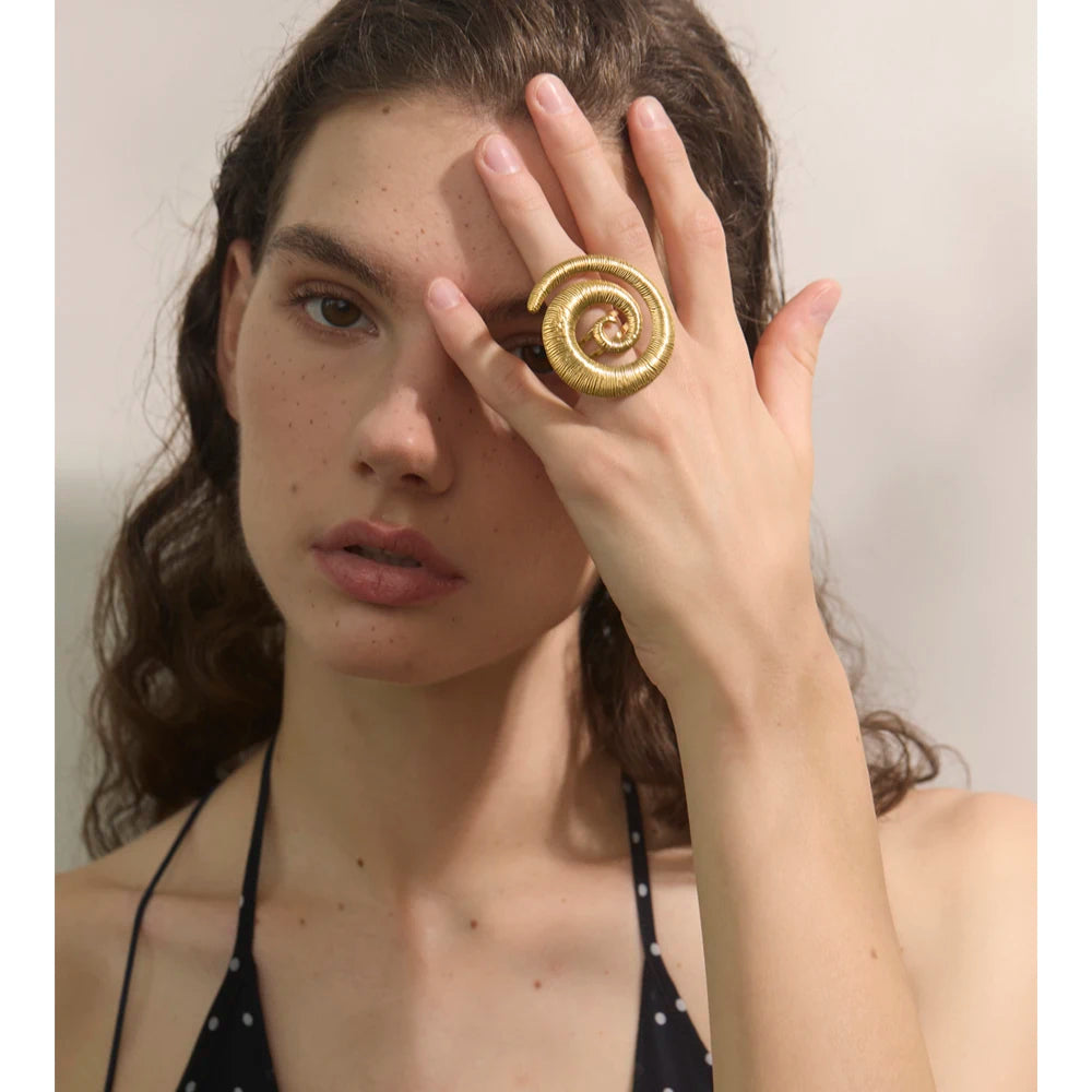 Goldish jewelry open ring layered alongside other gold rings gold favorites