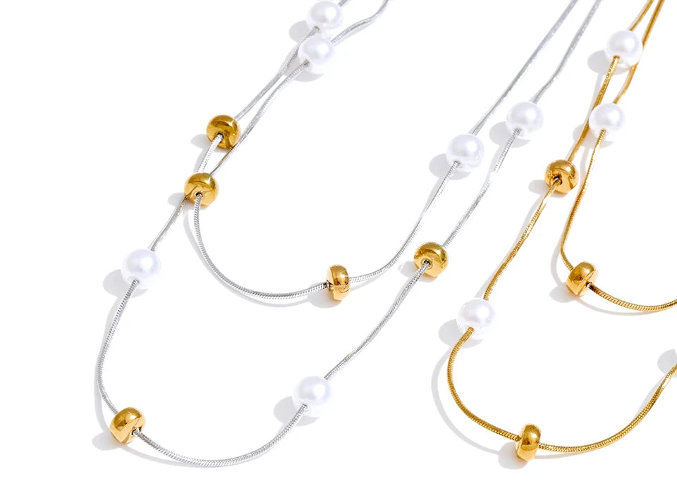 Pearl in necklace detail with refined chain overlay