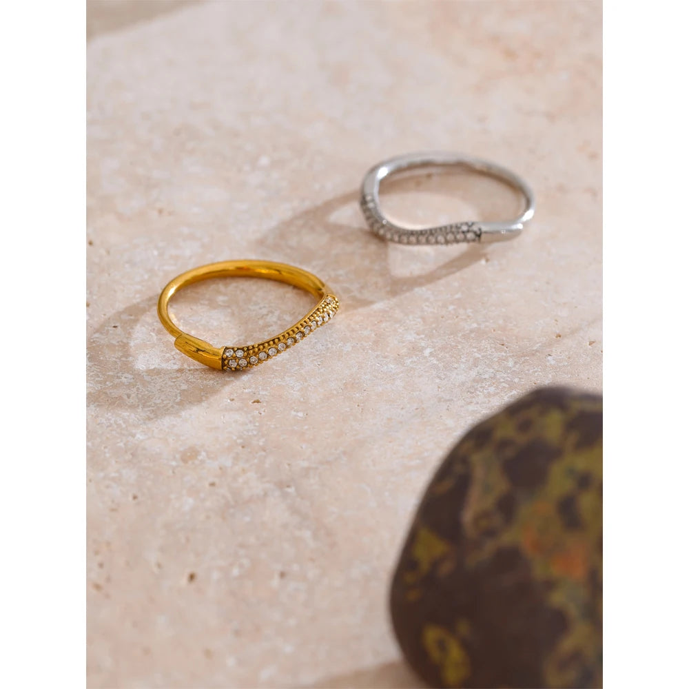 Close-up of thin ring showing cubic zirconia sparkle and gold plated band