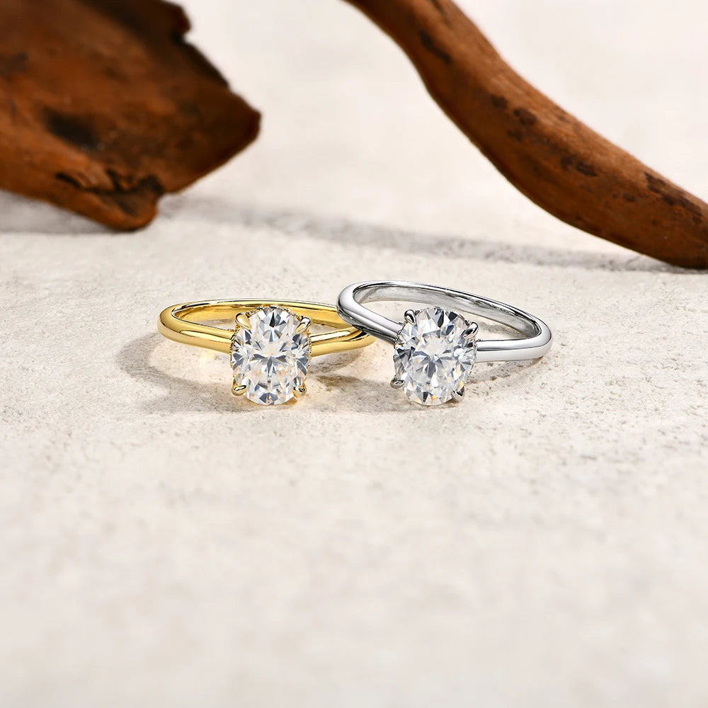 Rings with moissanite arranged beside an oval diamond rings centerpiece