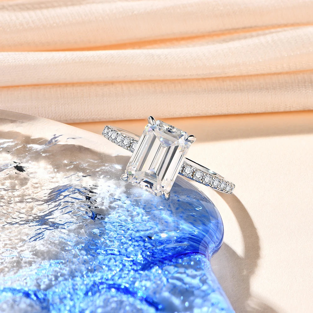 Sterling silver ring showcasing moissanite diamonds on a smooth band