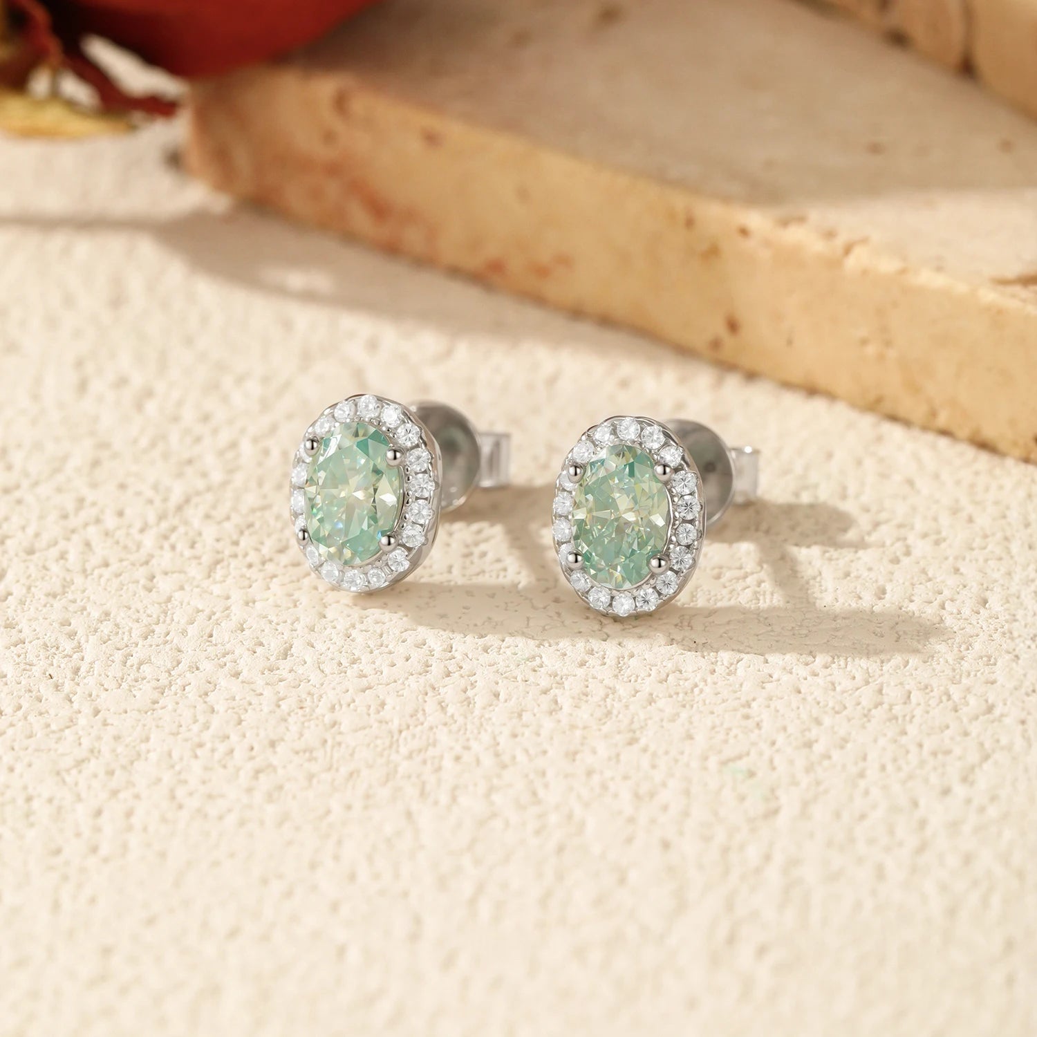 Elegant stud earrings for women featuring green moissanite halo design