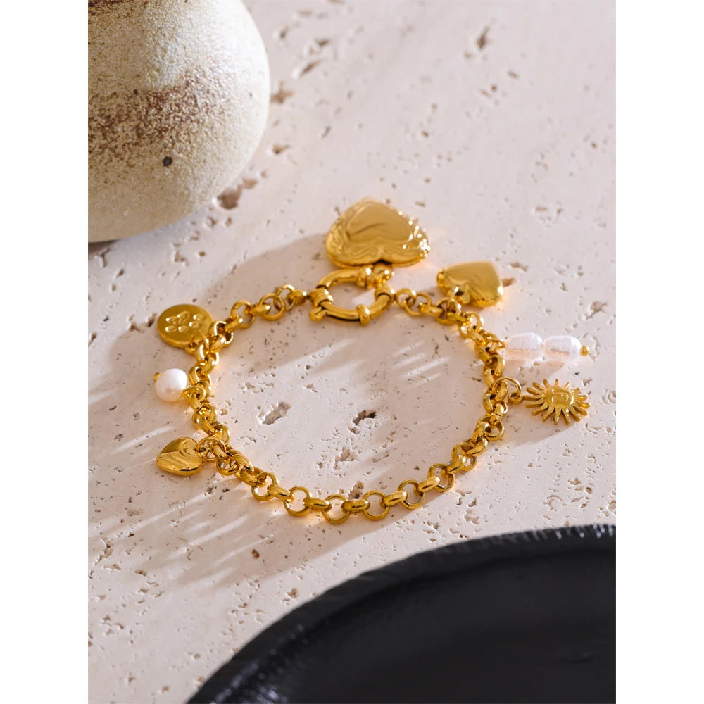 Heart bracelet centerpiece surrounded by bracelet charms for a romantic look