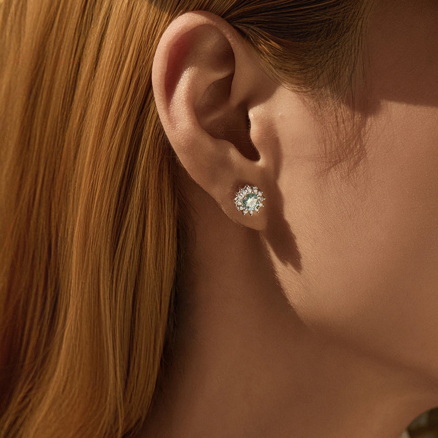 Sterling silver earrings featuring vivid green moissanite diamond