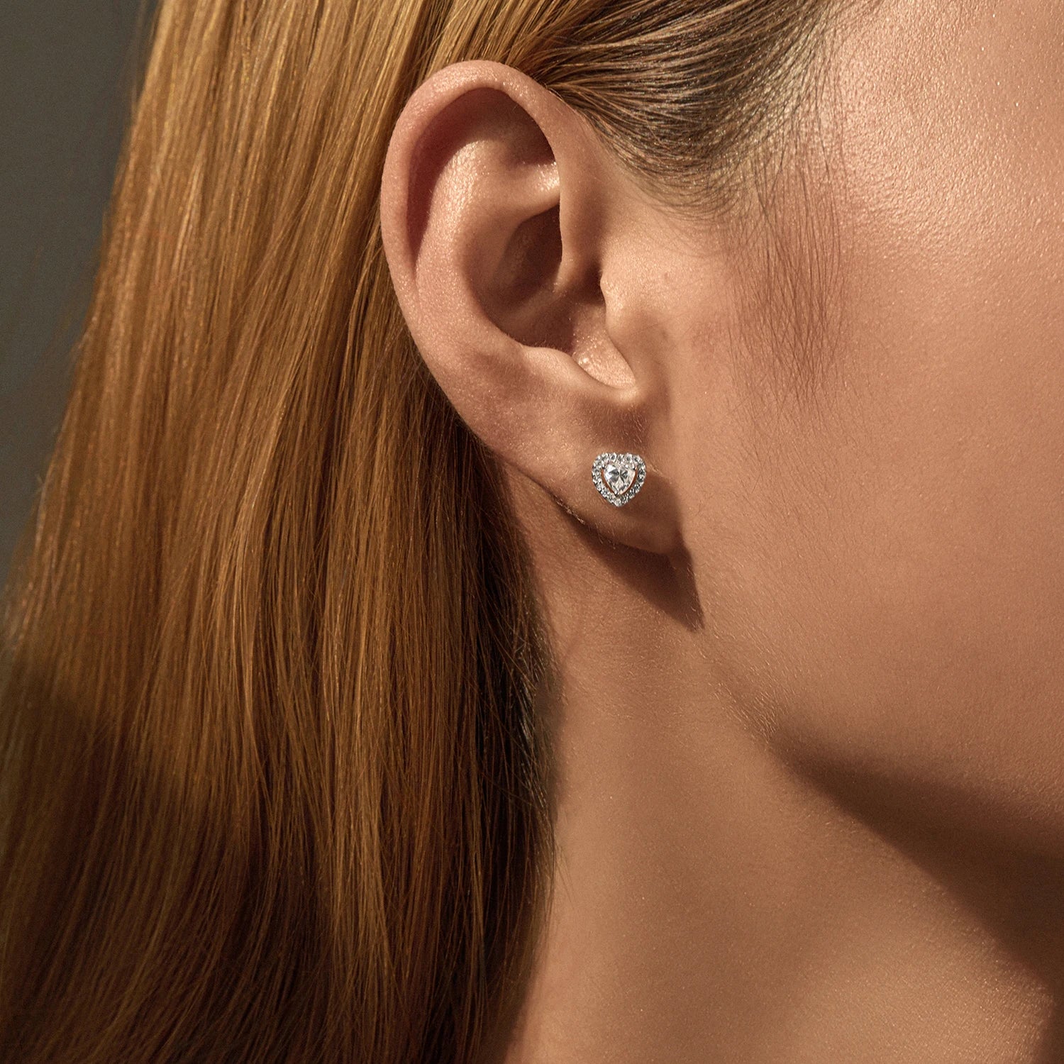 Sterling silver earrings with radiant heart shaped moissanite