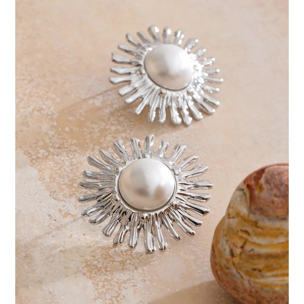 Close up of stud earrings gold earrings with imitation pearls