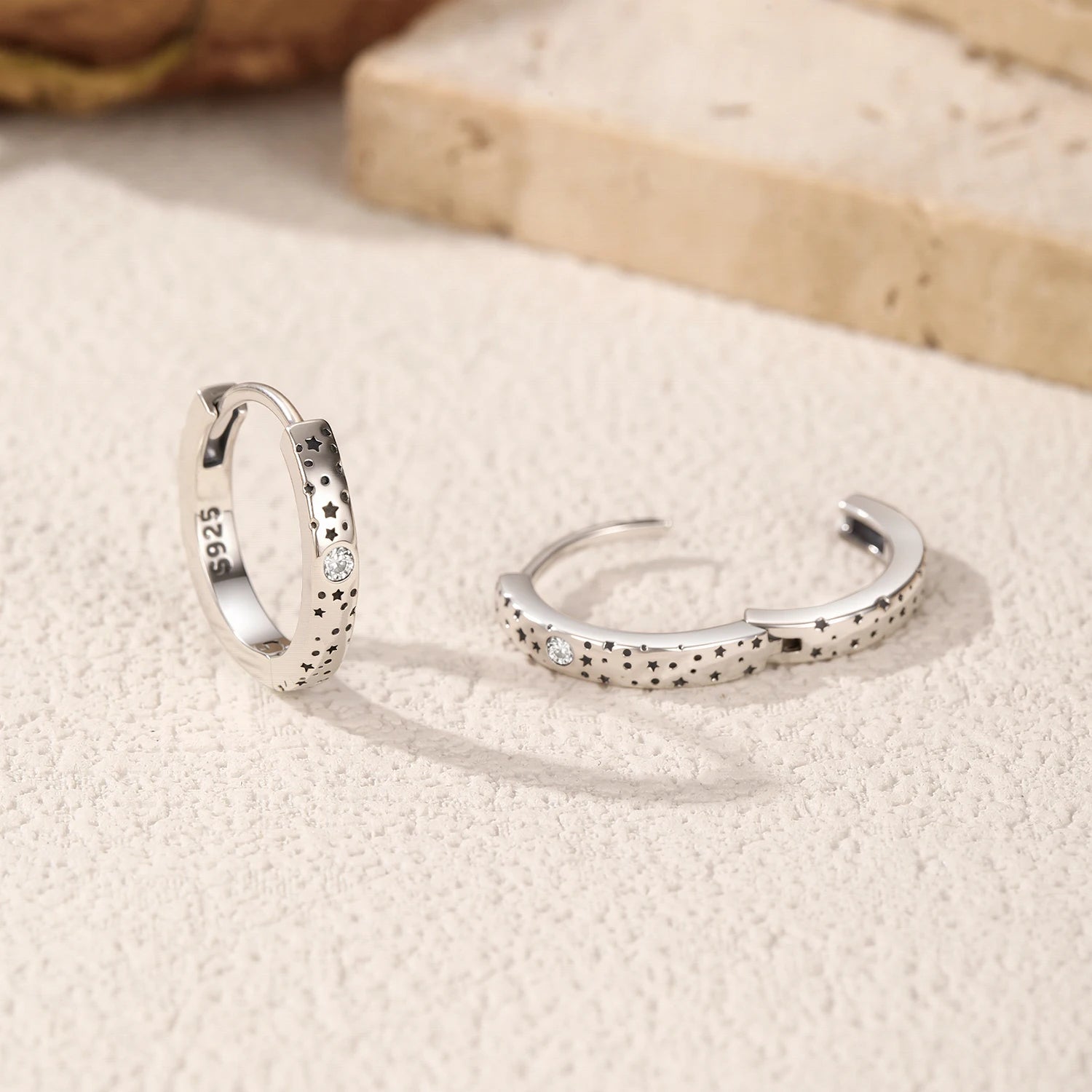 Sparkle ear buckles featuring D color moissanite stones