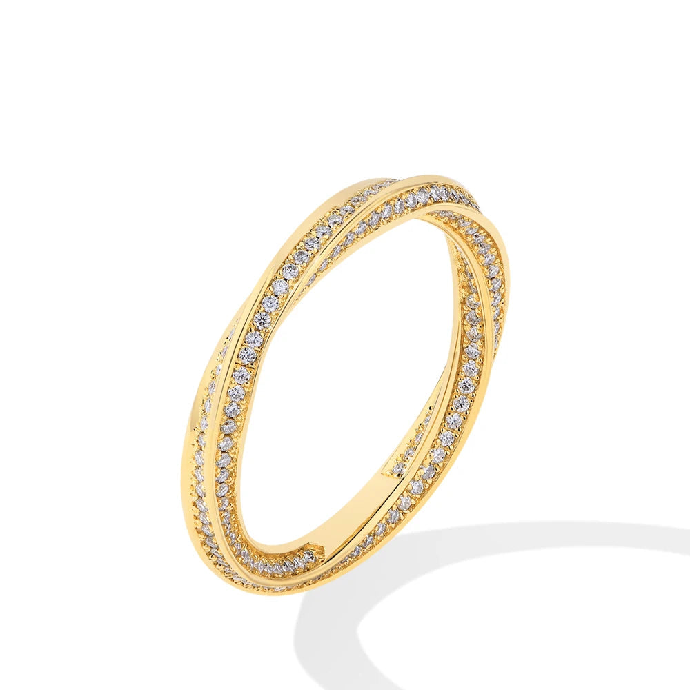 Gold and ring pairing with a moissanite ring for layered style