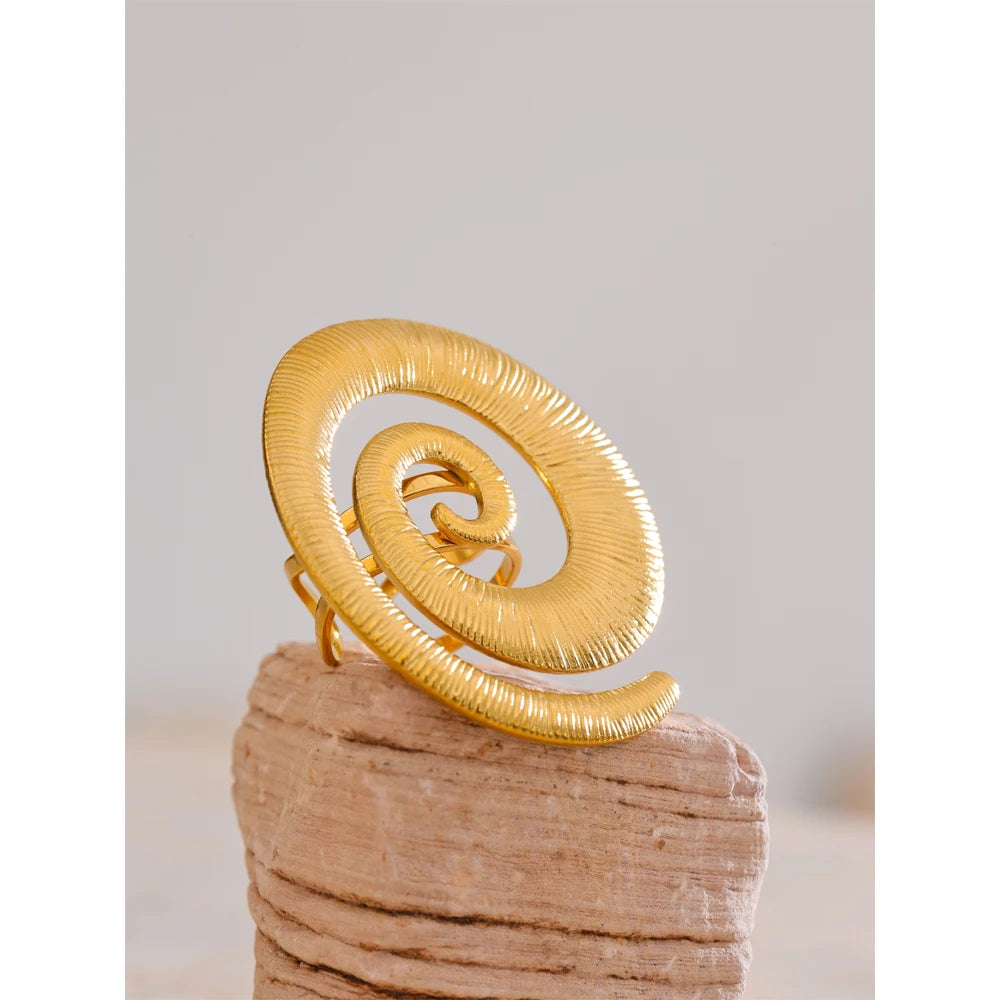 Gold women ring featuring twisted bands and unique geometric styling
