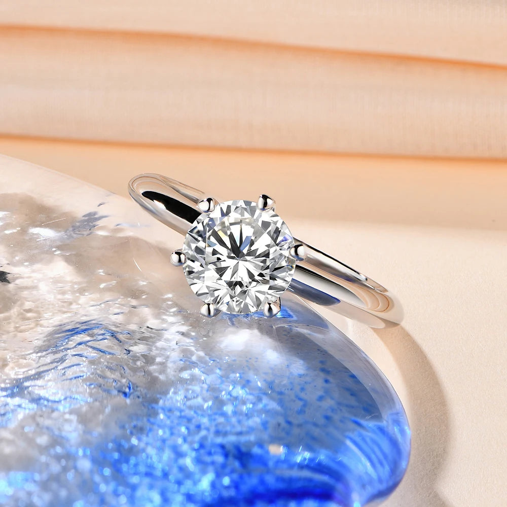 Silver ring showcasing moissanite diamond in a classic setting