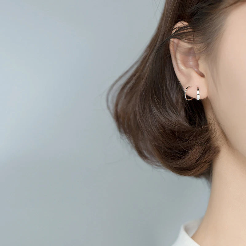 Sterling silver earrings styled as stud earrings with elegance